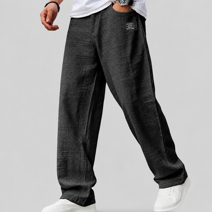 Close-up of the linen fabric on men's relaxed-fit trousers