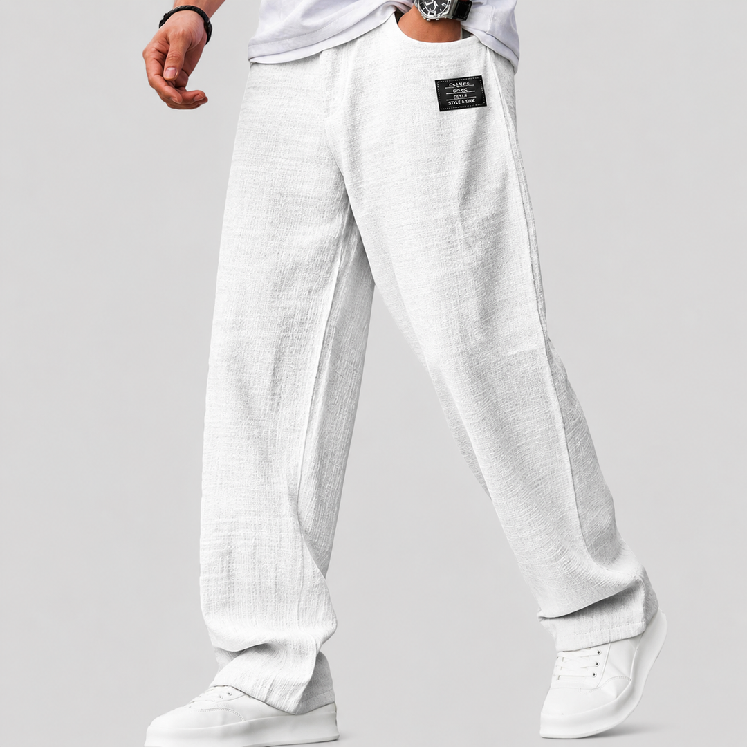 Close-up of the drape and texture of the wide-leg linen trousers