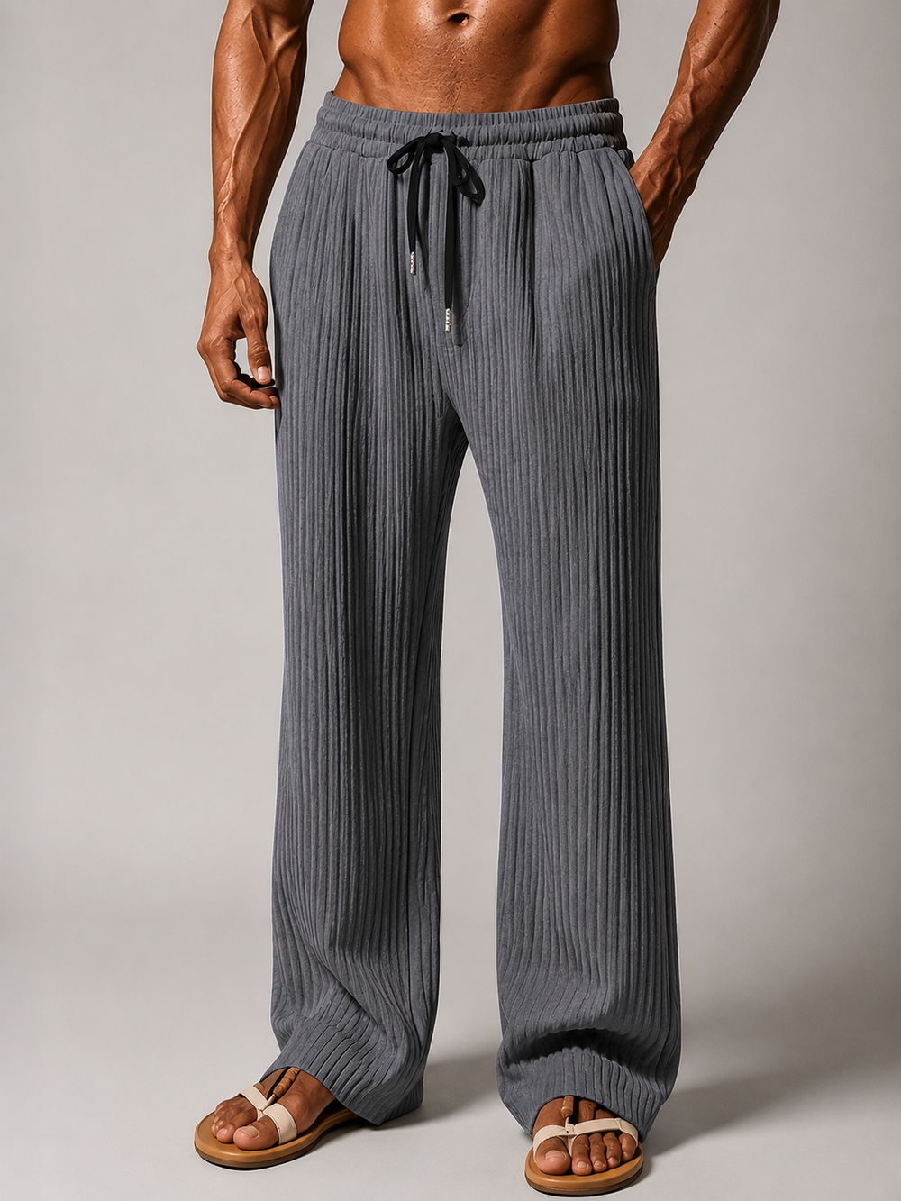 Men's ribbed trousers with straight leg and pleated front shown from the rear