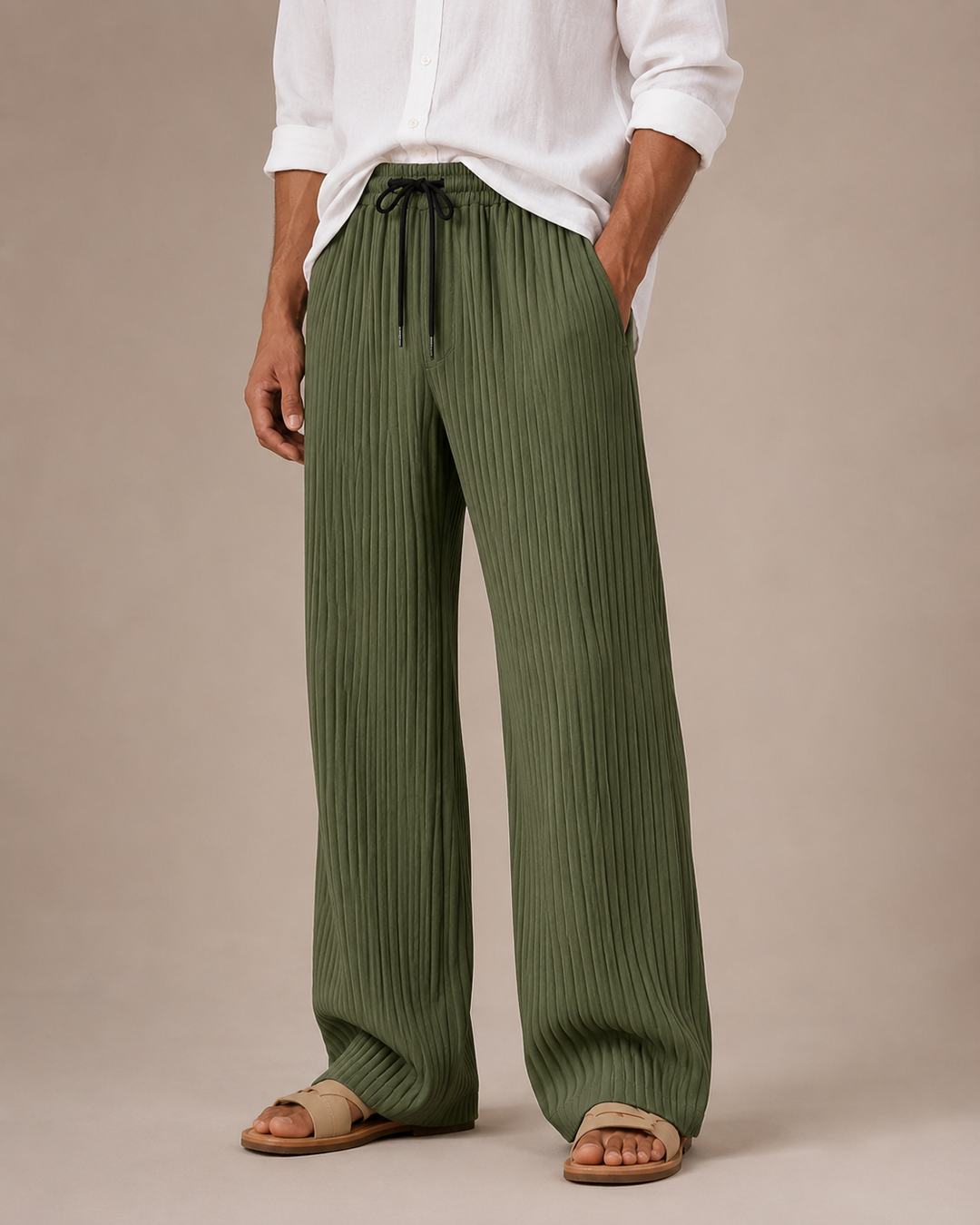 Detail of the pleated front on men's relaxed-fit ribbed trousers