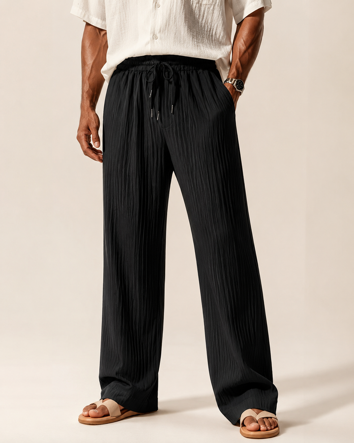 Men's ribbed straight-leg trousers shown in a three-quarter view