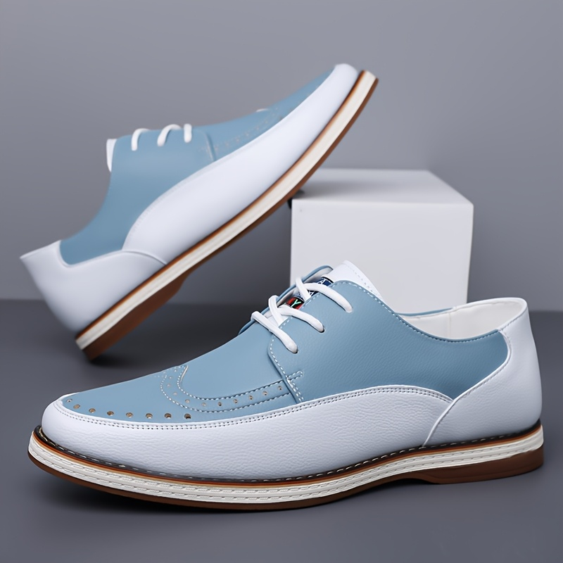 Front view of men's two-tone brogue shoes with lace-up fastening