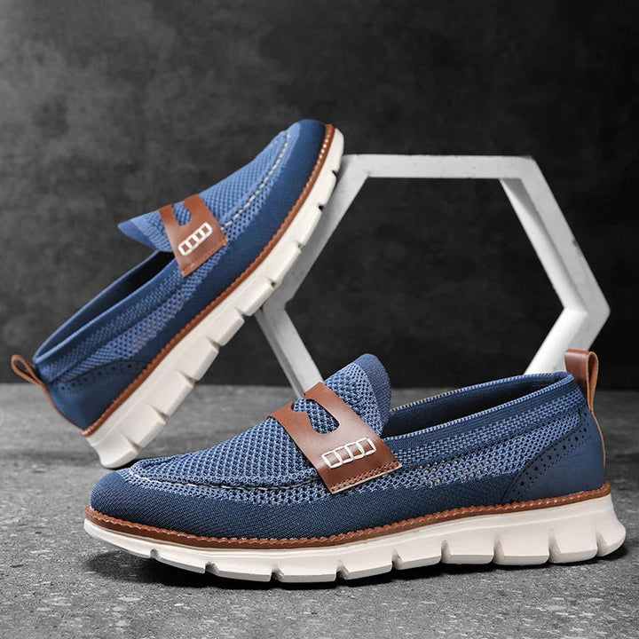 Pair of men's mesh penny loafers showing the penny strap detail