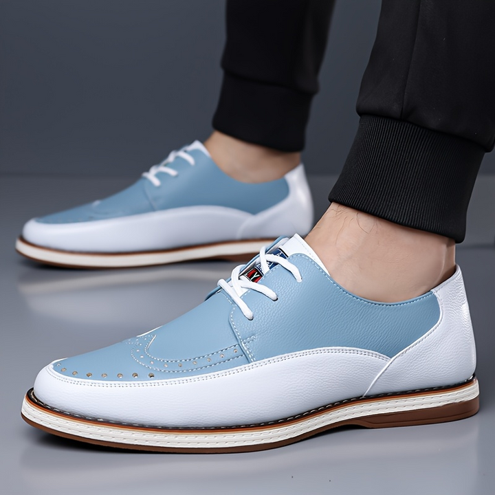 Top view of men's leather brogue shoes showing perforated pattern and laces