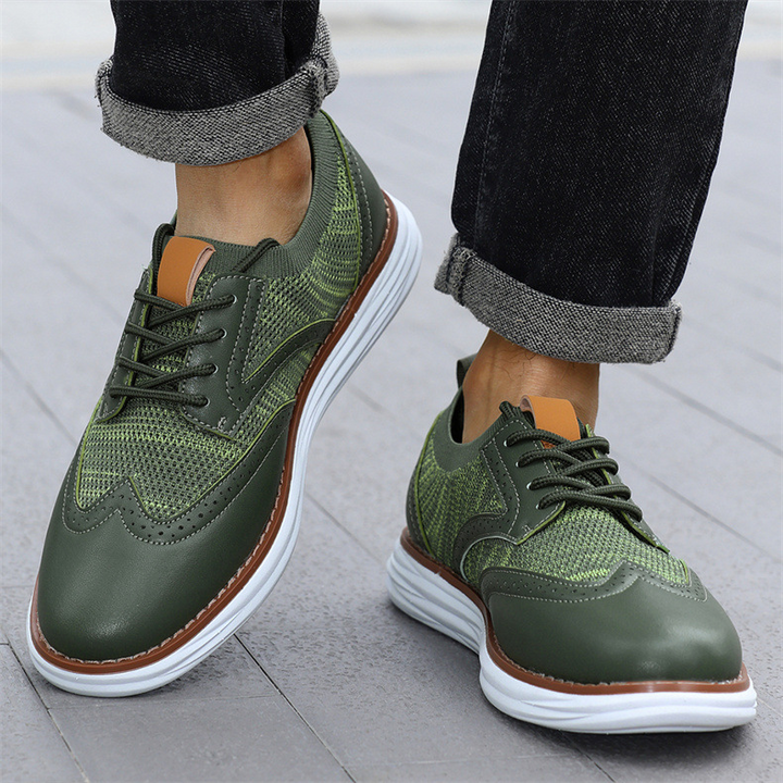 Men's mesh leather trainers angled view highlighting textured sole and upper