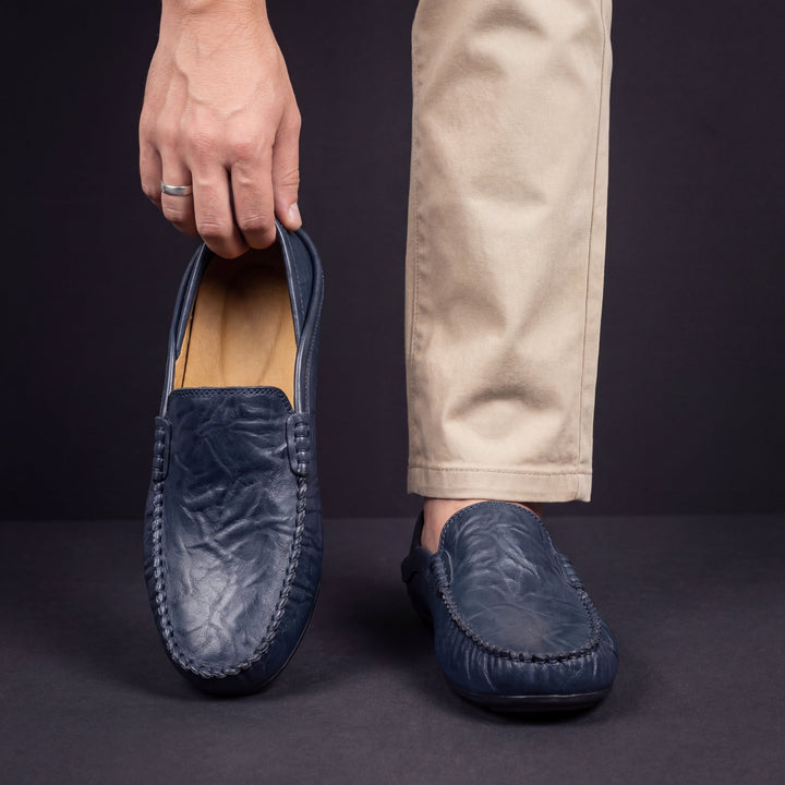 Side profile of men's refined loafers with a sleek silhouette