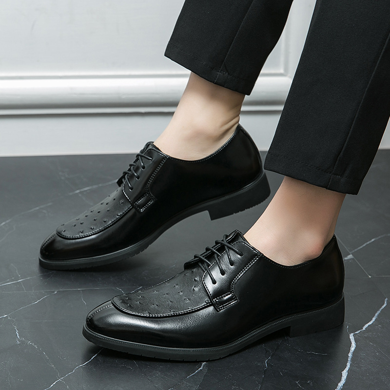 Men's ostrich leather dress shoes styled in a formal presentation