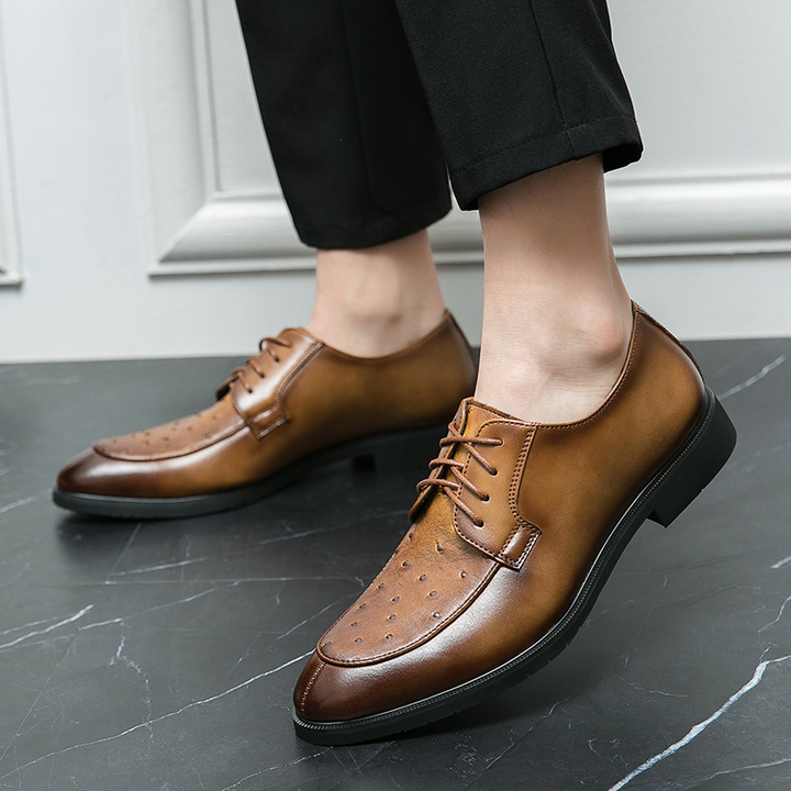 Close-up of ostrich leather texture on men's dress shoes