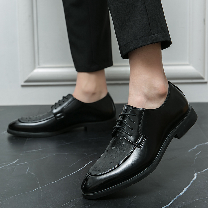 Sole view of men's ostrich leather dress shoes