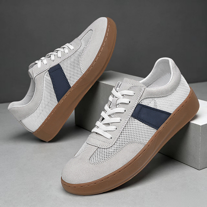 Pair of men's cobalt mesh suede sneakers angled from the front