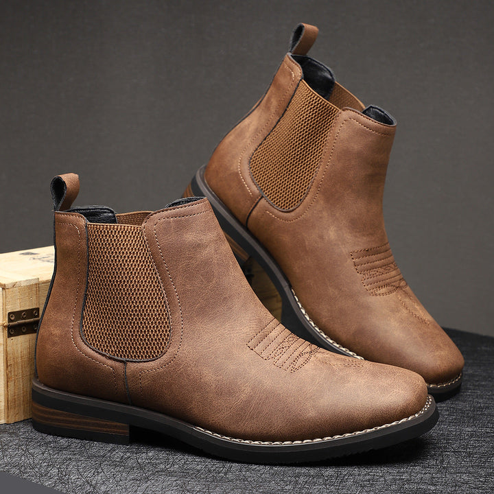 Men’s leather boots shown with their textured soles