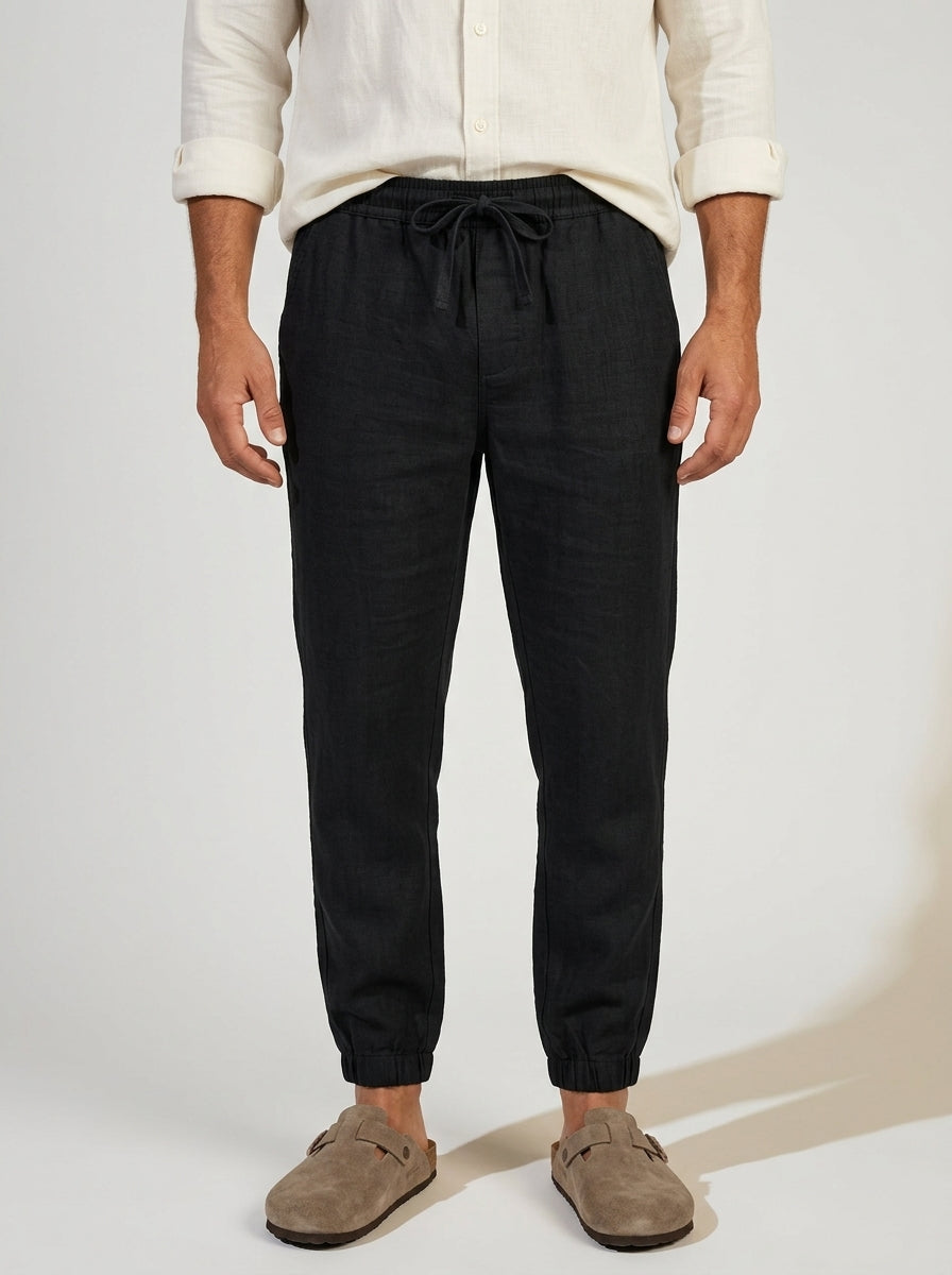 Full-length view of men's relaxed fit linen joggers on a model