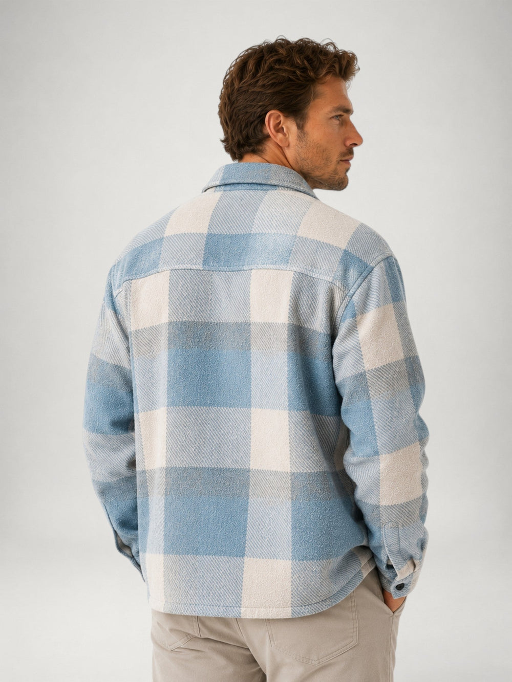Men's plaid flannel overshirt displayed from the back