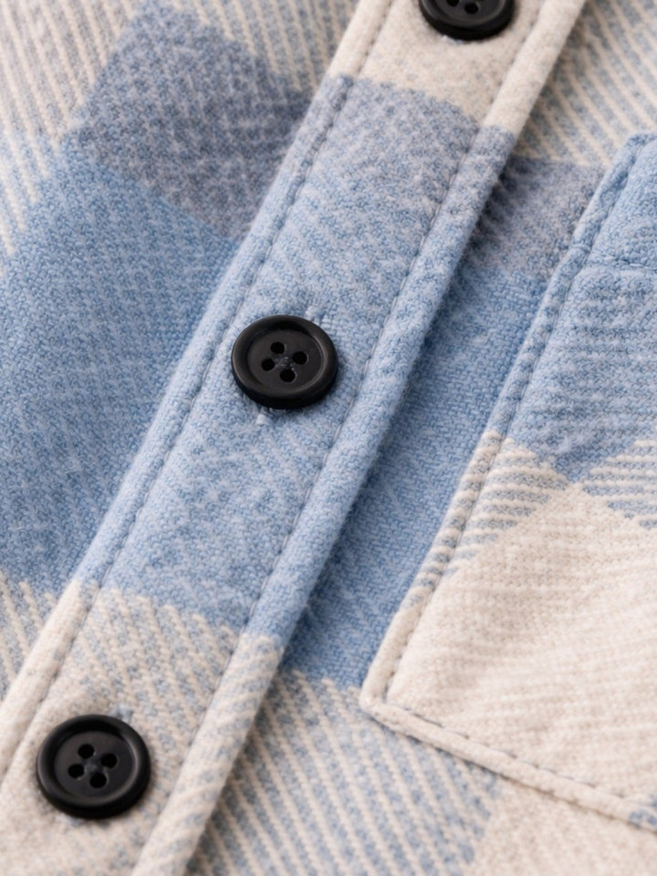 Men's checked shirt shown with sleeves down and front buttons fastened