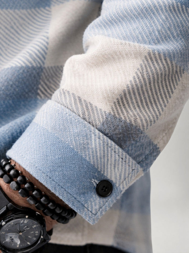 Plaid flannel shirt styled open as a casual overshirt