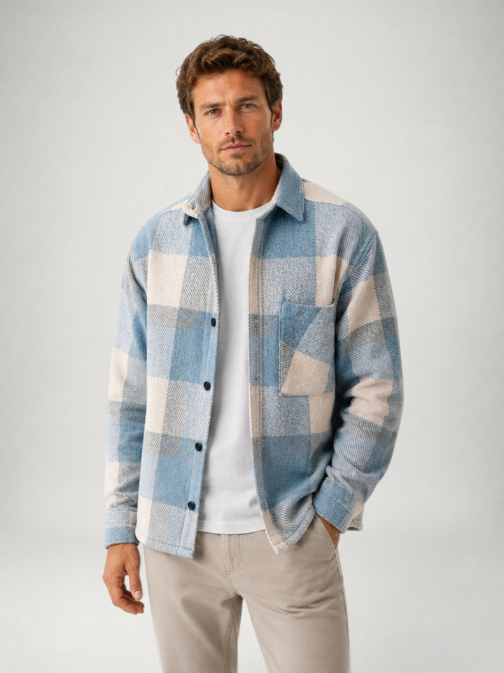 Close-up of shirt cuff and sleeve in soft plaid flannel