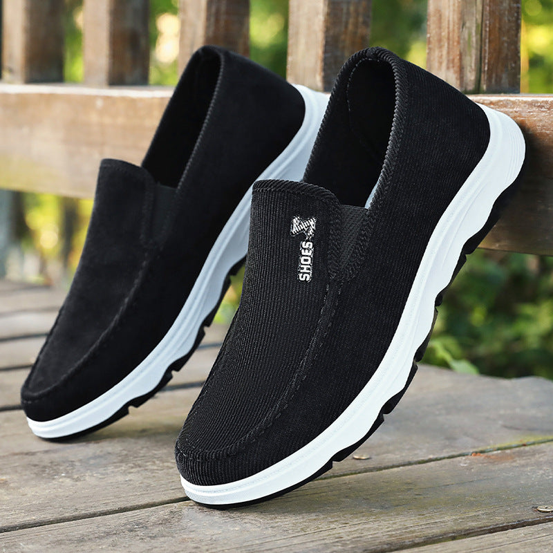 Pair of men's casual slip-on shoes with ribbed textile uppers