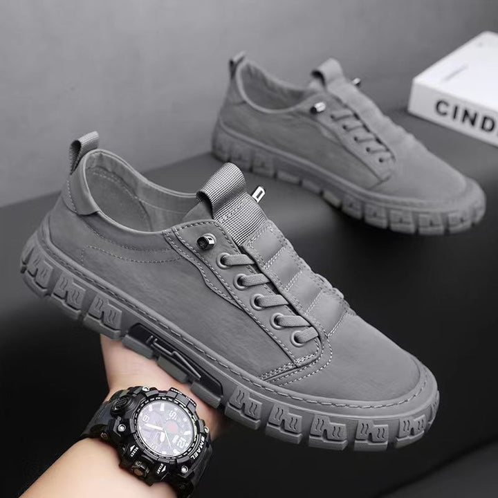 Side profile of men's canvas trainers with durable canvas upper