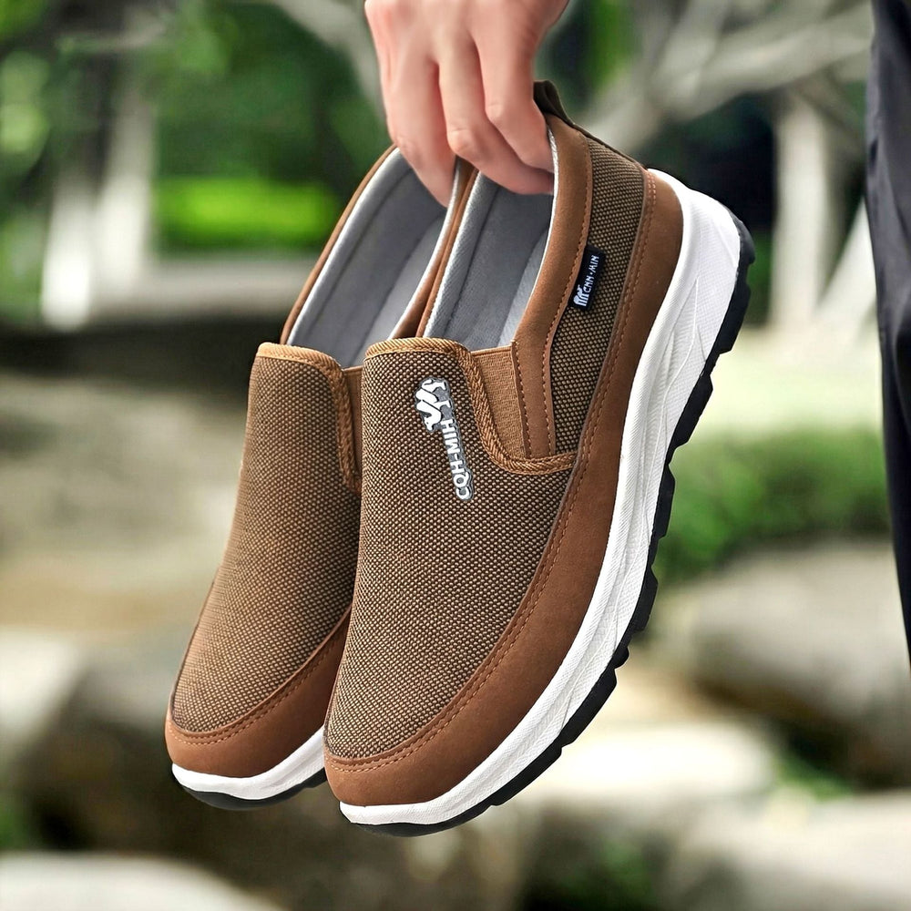 Side view of men's slip-on trainers with a supportive upper