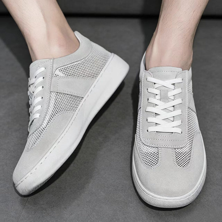Pair of men's cobalt mesh suede sneakers displayed on a white background