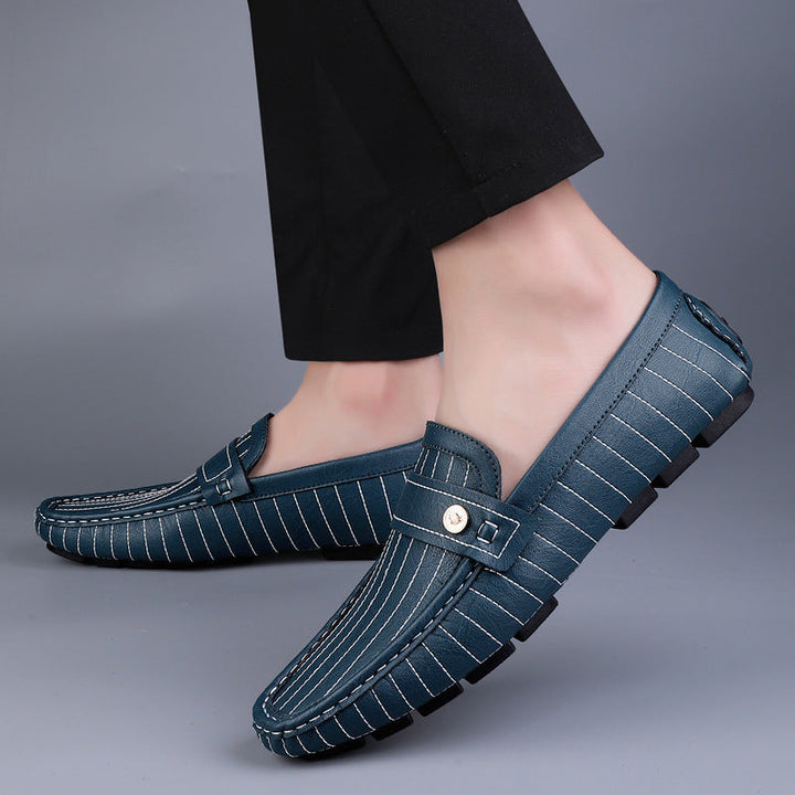 Men's leather loafers with metal detail showing the back heel