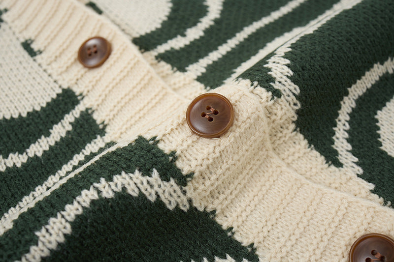 Detail of the button fastening on the abstract swirl cardigan