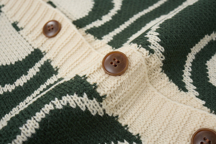 Detail of the button fastening on the abstract swirl cardigan