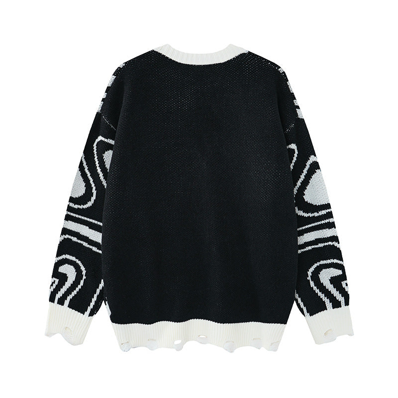 Close-up of the abstract swirl knit pattern on the cardigan