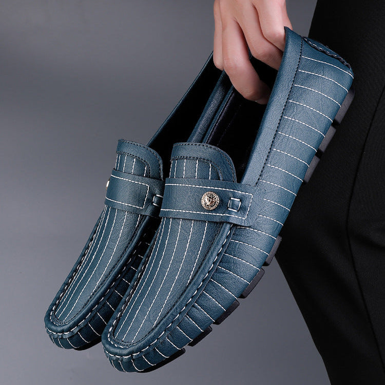 Men's leather loafers with metal detail displayed from the top