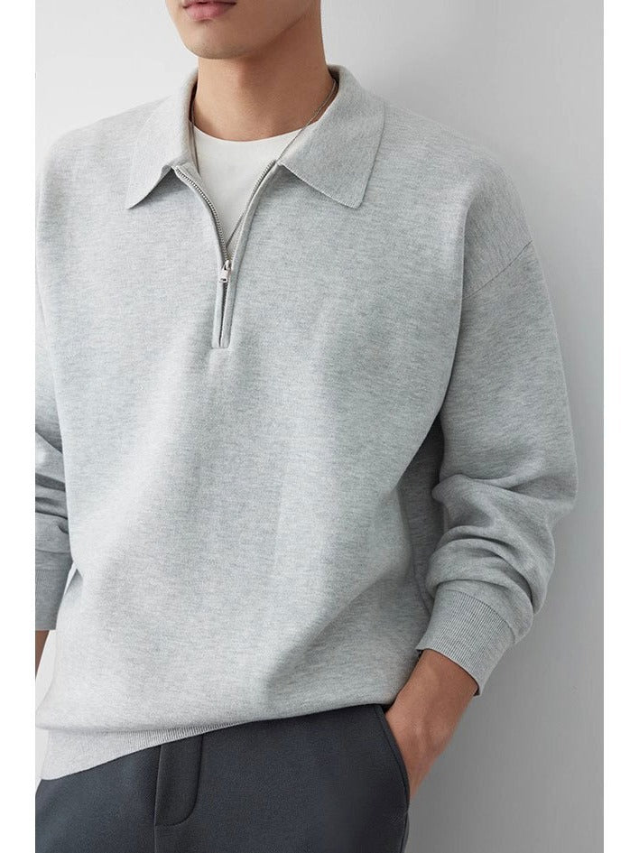 Close-up of the polo collar and button neckline on the sweatshirt