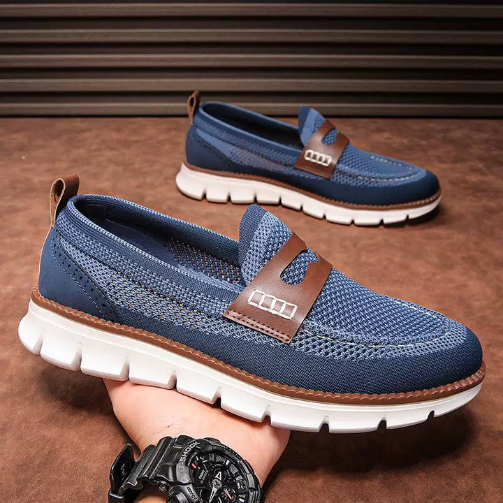 Men's slip-on penny loafer displaying its breathable mesh upper