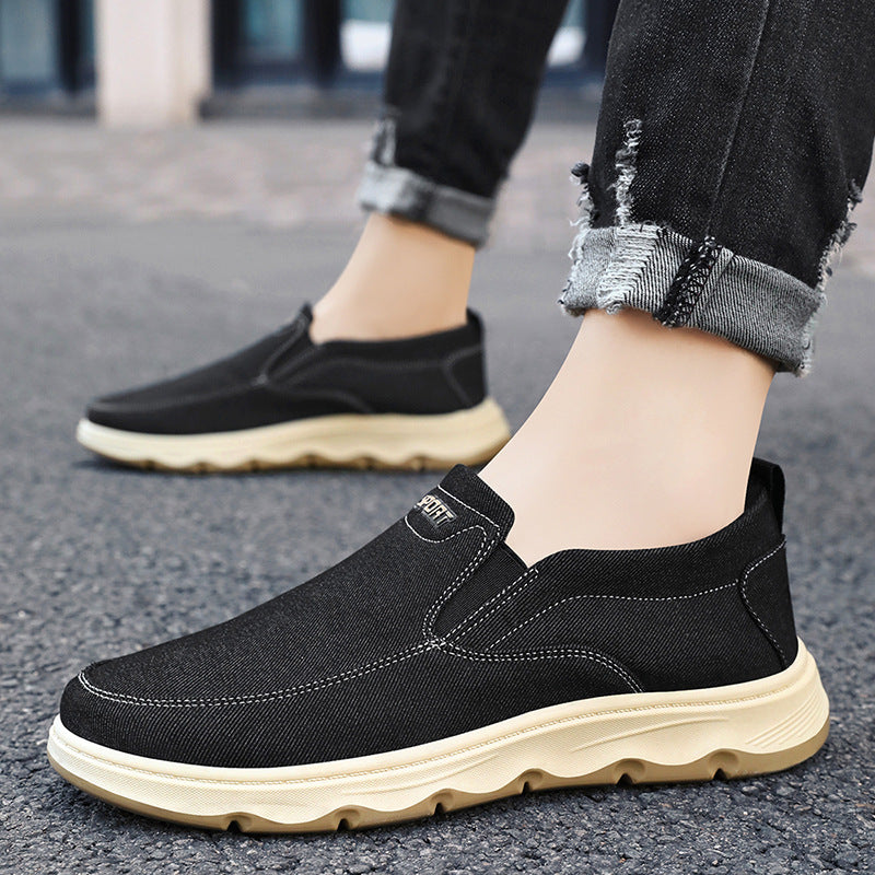 Pair of men's canvas slip-on trainers with flexible construction