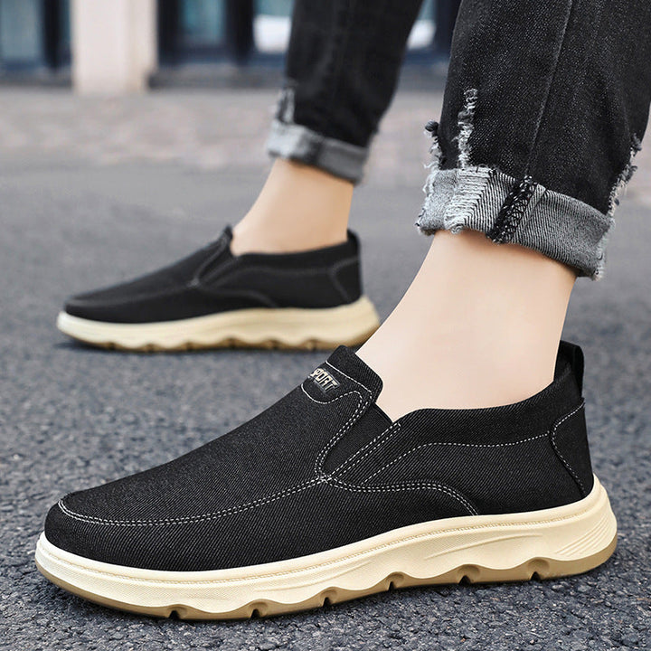 Pair of men's canvas slip-on trainers with flexible construction