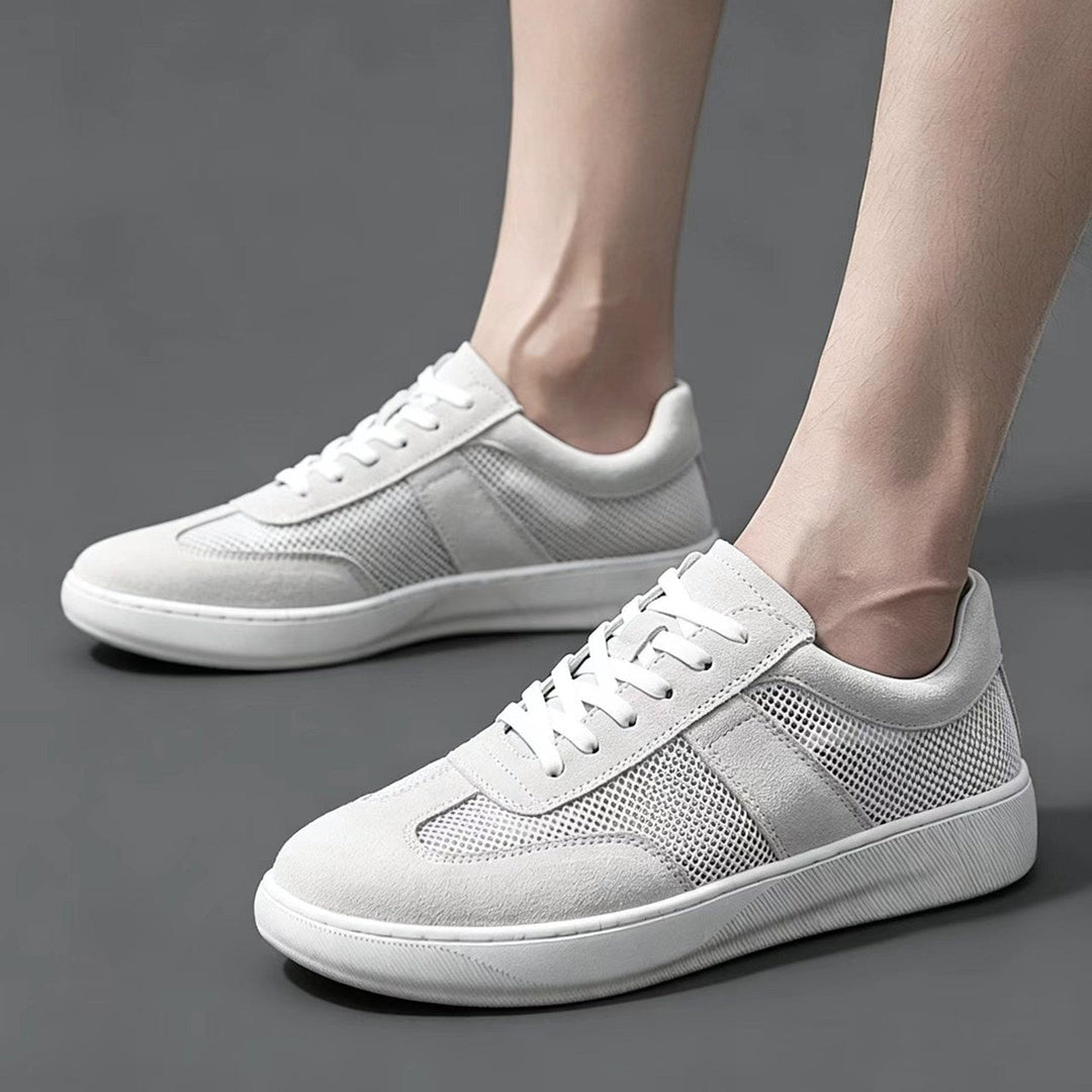 Close-up of mesh and suede panels on men's cobalt sneakers
