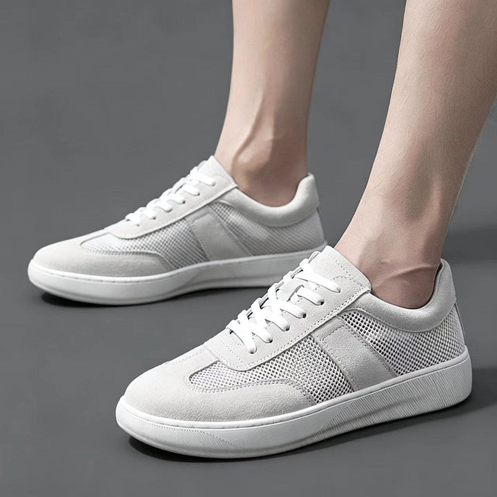 Close-up of mesh and suede panels on men's cobalt sneakers