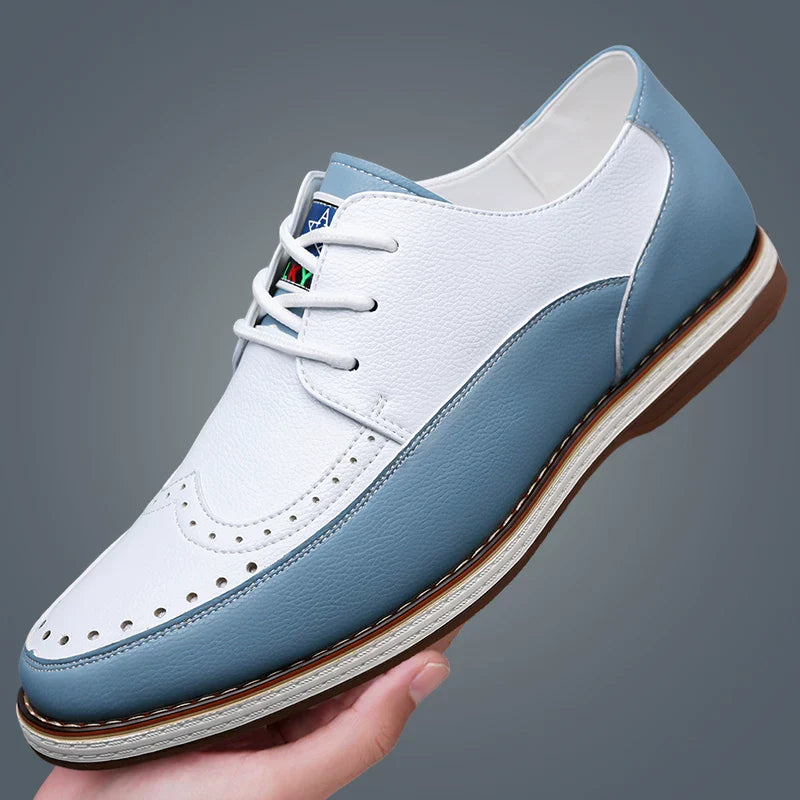 Close-up of two-tone leather brogue detailing on men's formal shoes