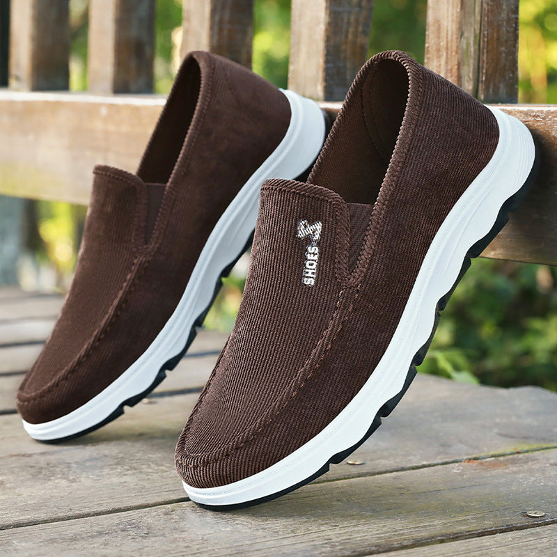 Men's ribbed textile slip-on shoes shown from the side
