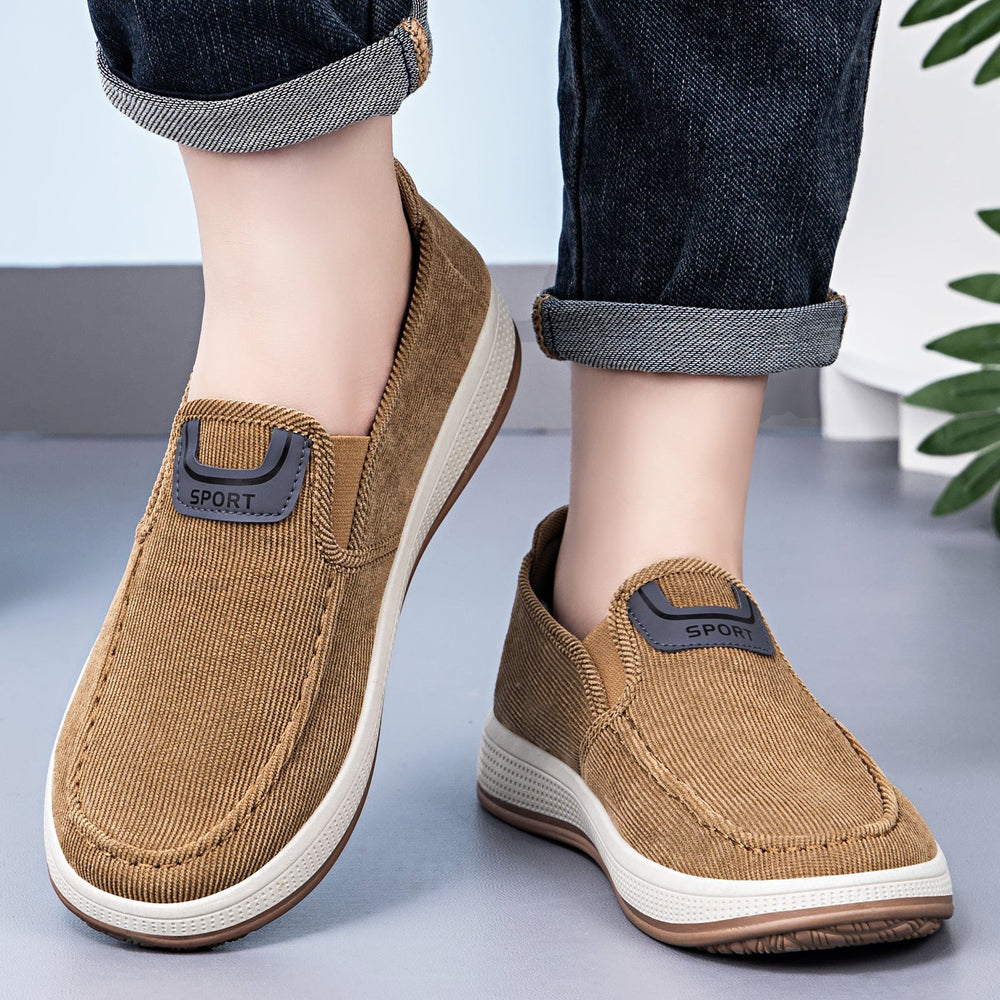 Men's cord slip-on trainers showing the elasticated entry