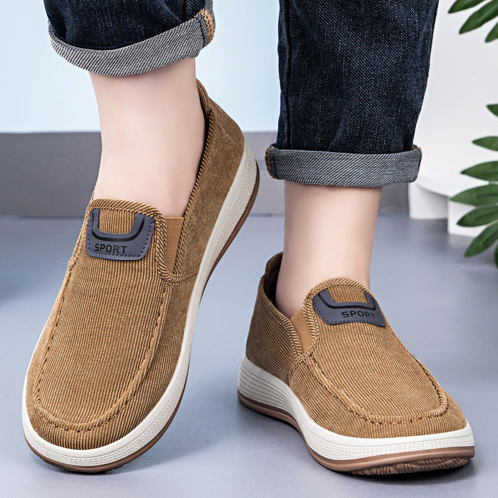 Men's cord slip-on trainers showing the elasticated entry