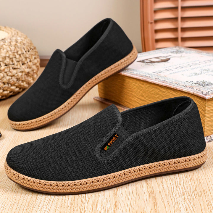 Men's breathable knitted slip-on shoes shown from the side