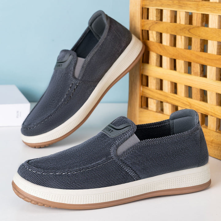 Men's cord slip-on trainers shown from the side