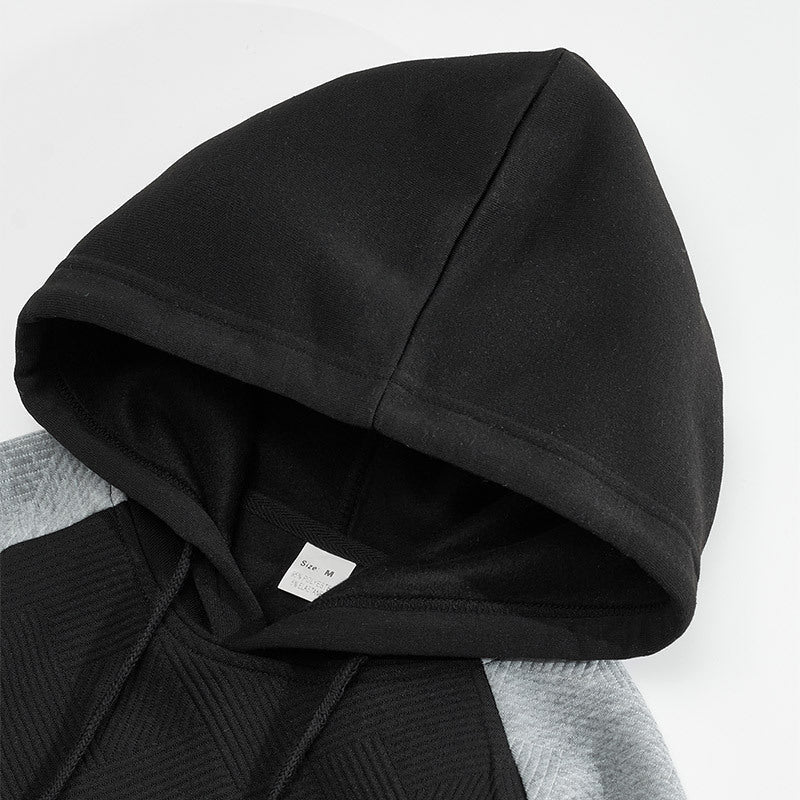 Close-up of the textured panel detail on the men's hoodie