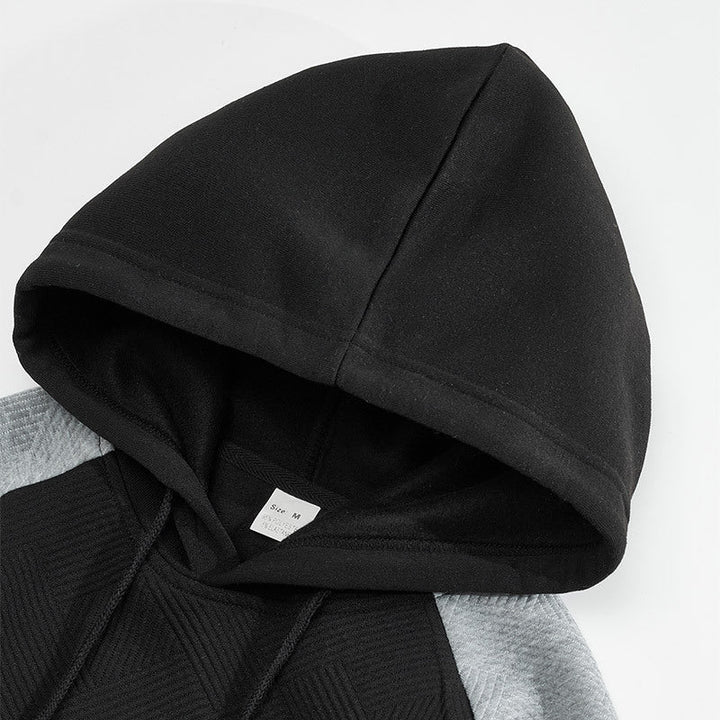 Close-up of the textured panel detail on the men's hoodie