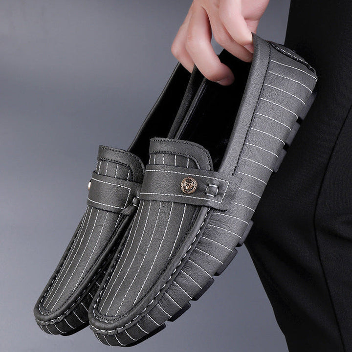 Pair of men's leather loafers angled to show shape and finish