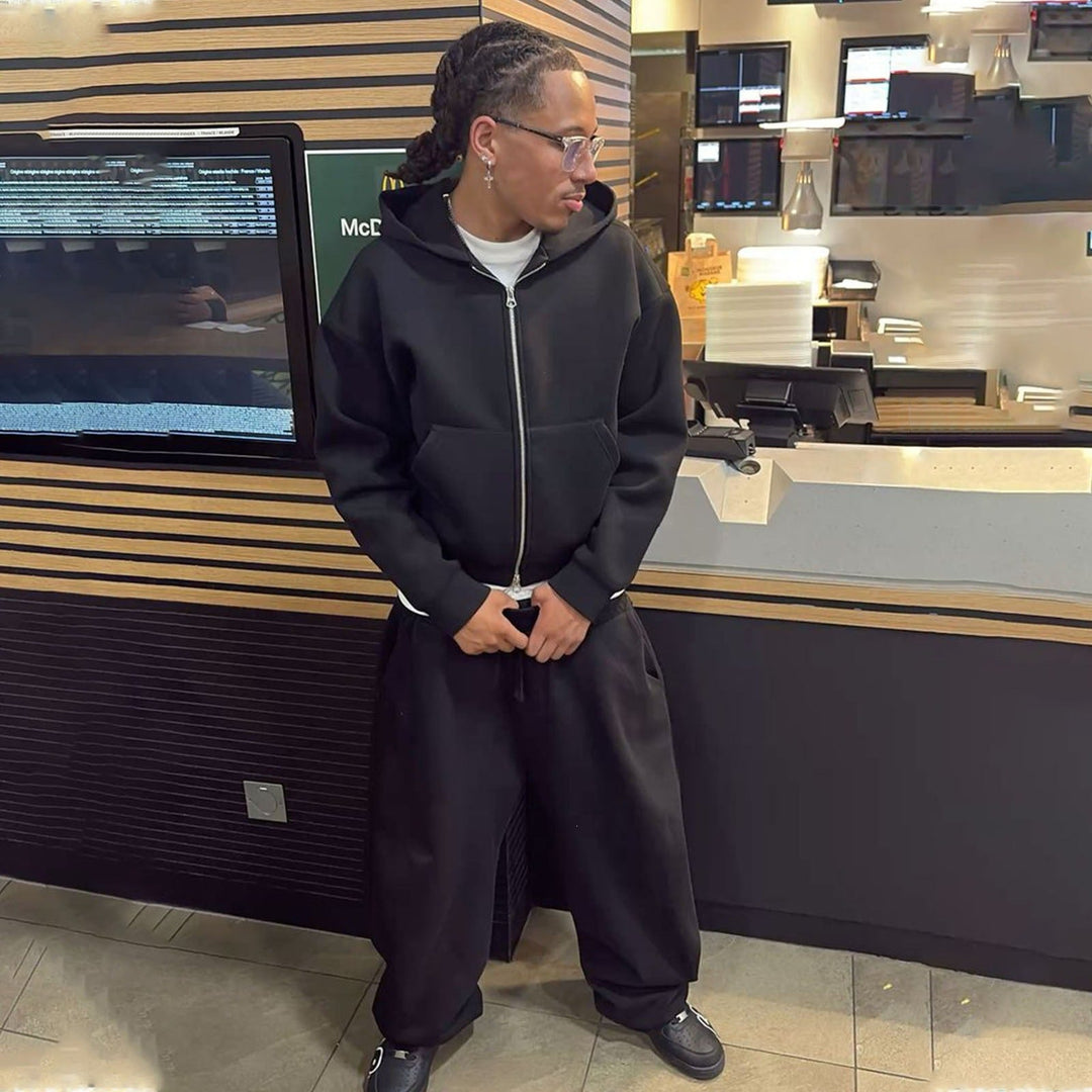 Relaxed men's sweatpants paired with an oversized zip hoodie