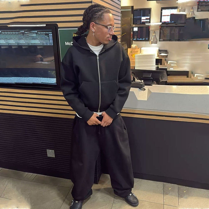 Relaxed men's sweatpants paired with an oversized zip hoodie