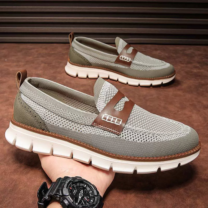Pair of men's penny loafers with mesh uppers and leather edging