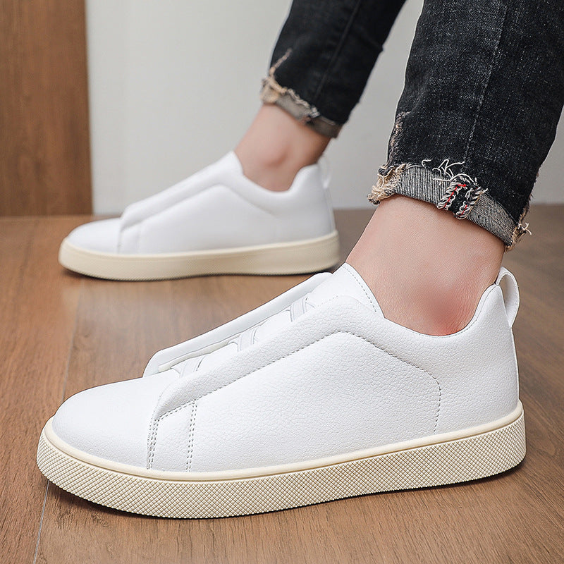Side profile of a men's leather trainer with textured sole
