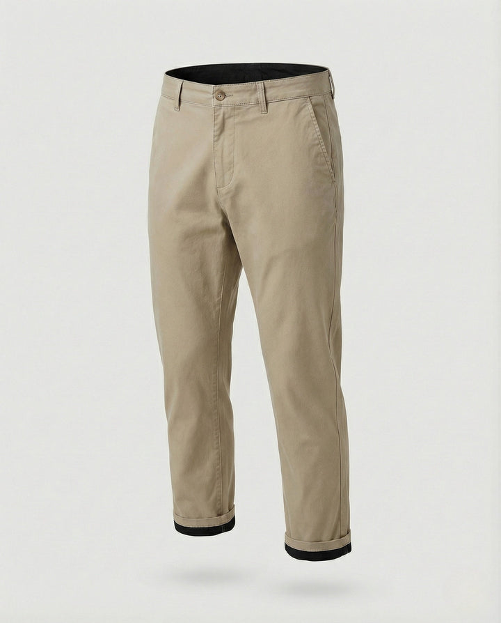 Waistband and fastening detail on men's tapered chinos
