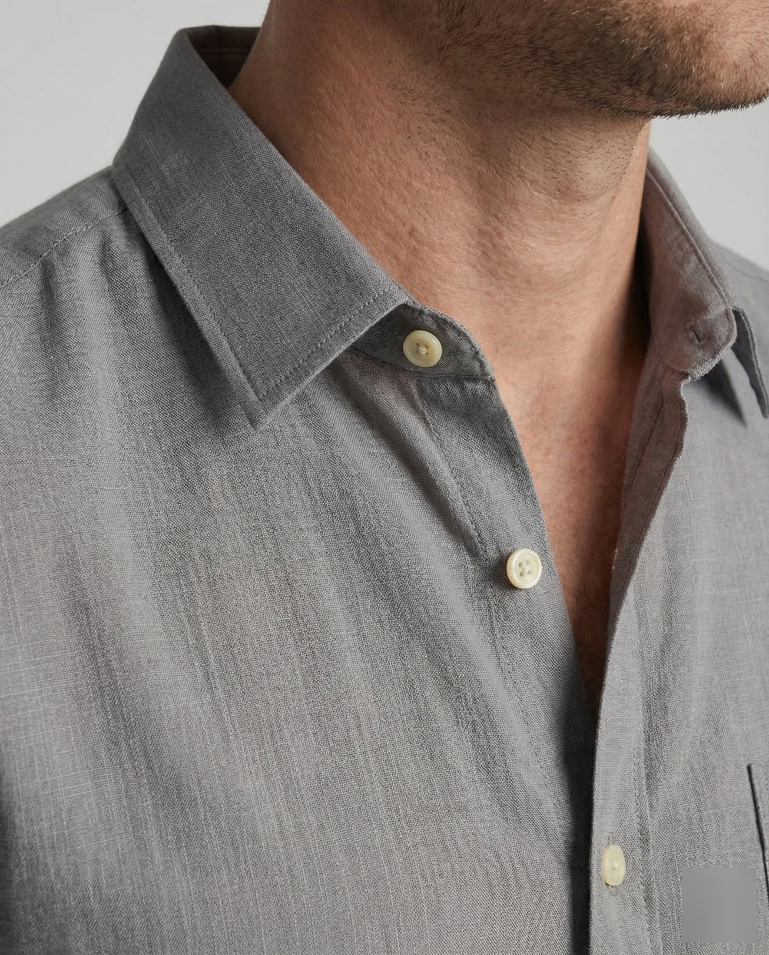 Close-up of the men's linen shirt fabric and short sleeve detail
